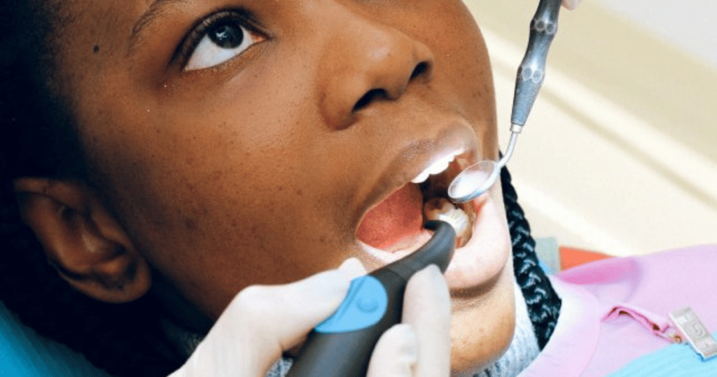 Dental blog: Visit dentist during Covid - girl getting her teeth checked