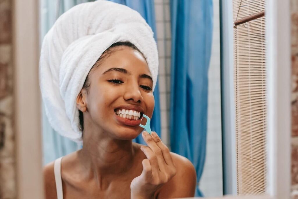 Dental blog: girl flossing - dental gadgets
